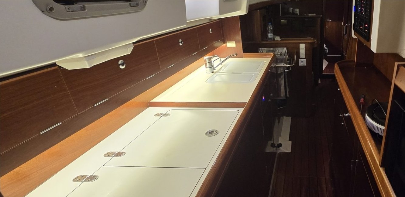 The Calma's galley, mahogany trim, stainless double sink